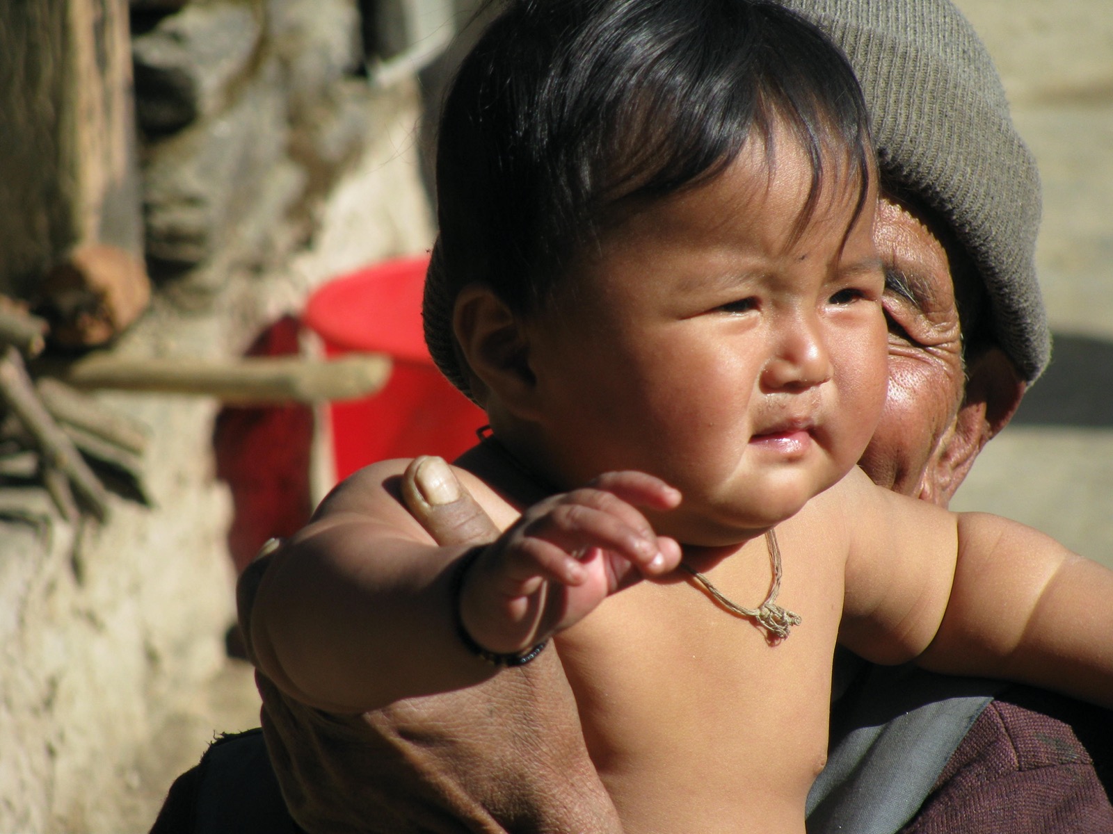 Old lady holding a baby